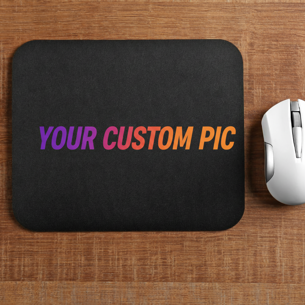 A black custom printed mousepad with a wood grain background and a white computer mouse on top of it, placed on a wooden table.